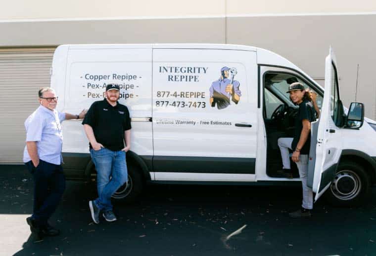 Integrity Repipe team standing by van
