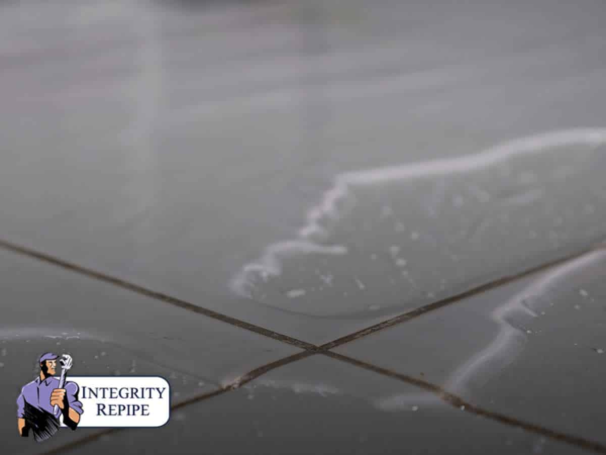 Water on tile floor indicating a possible slab leak